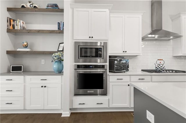 3 Hundley Ln, Roswell, GA 30076 - kitchen with stainless steel appliances, wall chimney exhaust hood, open shelves, white cabinets, and light countertops
