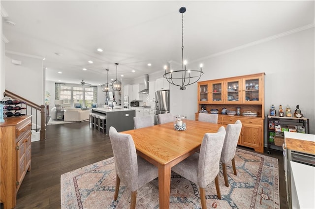 3 Hundley Ln, Roswell, GA 30076 - dining space featuring a chandelier, recessed lighting, crown molding, dark wood-style flooring, and stairs
