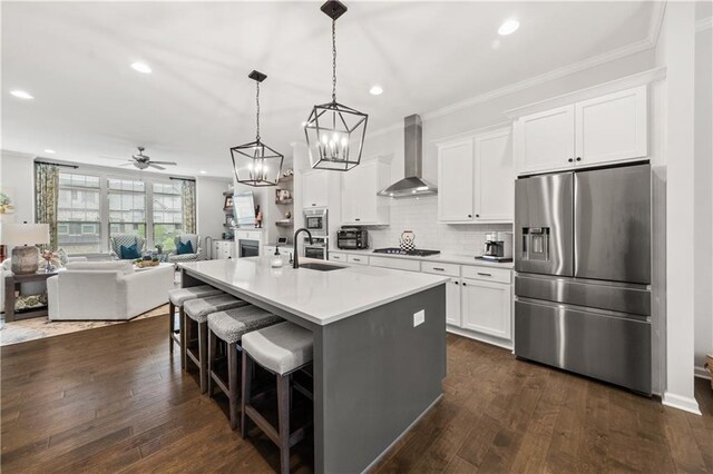 3 Hundley Ln, Roswell, GA 30076 - kitchen featuring appliances with stainless steel finishes, wall chimney exhaust hood, a sink, recessed lighting, and open floor plan