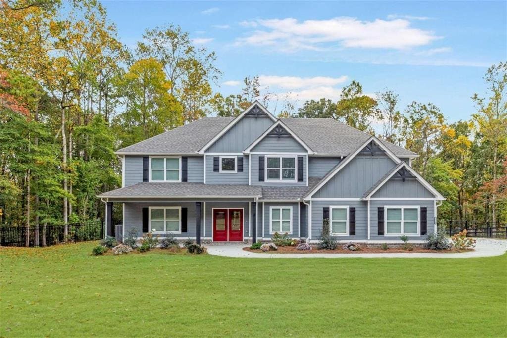 craftsman-style house with a front yard