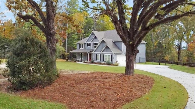 view of front facade with a front lawn and a garage