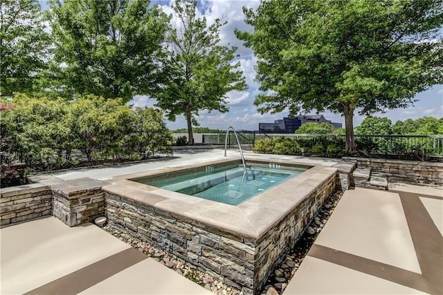 view of pool featuring an in ground hot tub and a patio area