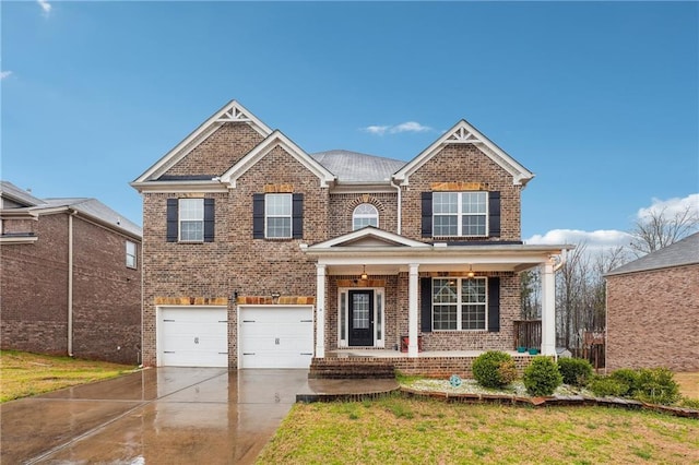 view of front of property with brick siding, a front lawn, a porch, concrete driveway, and an attached garage