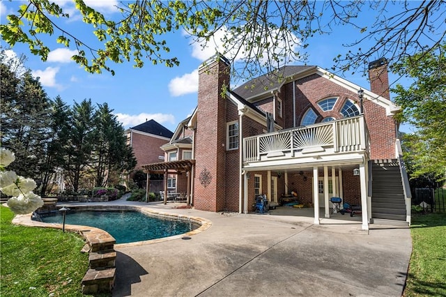 3855 Greenside Ct, Dacula, GA 30019 - back of property featuring brick siding, a chimney, a patio, and a balcony