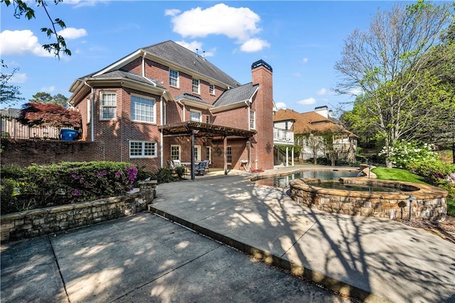 3855 Greenside Ct, Dacula, GA 30019 - rear view of property featuring fence, a pool with connected hot tub, brick siding, a deck, and a patio area
