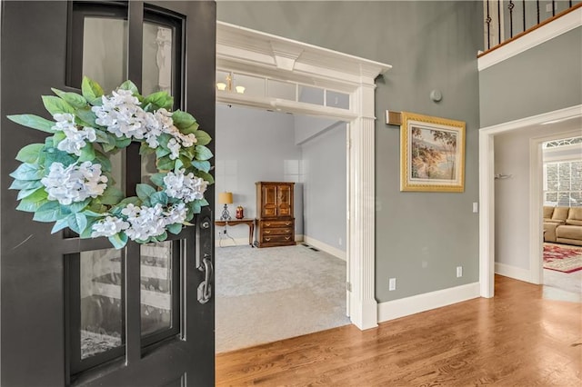 3855 Greenside Ct, Dacula, GA 30019 - entrance foyer with wood finished floors, baseboards, and a high ceiling