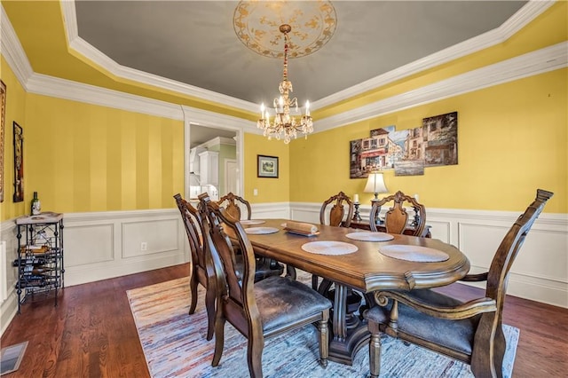 3855 Greenside Ct, Dacula, GA 30019 - dining room featuring an inviting chandelier, wood finished floors, visible vents, and a wainscoted wall