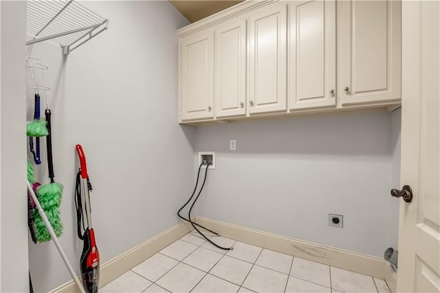 3855 Greenside Ct, Dacula, GA 30019 - laundry area featuring washer hookup, electric dryer hookup, cabinet space, baseboards, and light tile patterned flooring