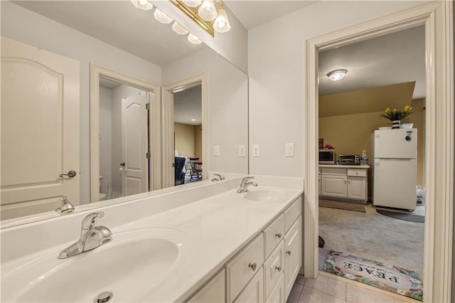 3855 Greenside Ct, Dacula, GA 30019 - bathroom with a sink, toilet, and double vanity