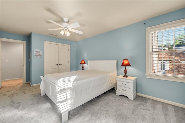 3855 Greenside Ct, Dacula, GA 30019 - bedroom with carpet floors, visible vents, a closet, baseboards, and ceiling fan