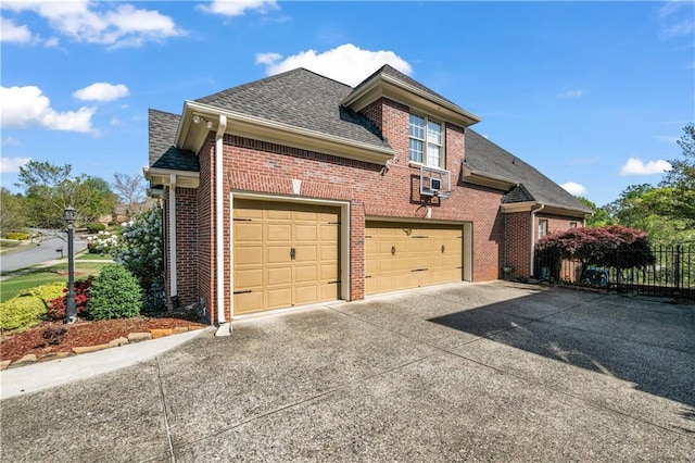 3855 Greenside Ct, Dacula, GA 30019 - view of front of home featuring fence, a shingled roof, concrete driveway, and brick siding