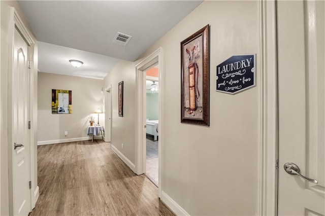3855 Greenside Ct, Dacula, GA 30019 - hall featuring light wood-style floors, baseboards, and visible vents