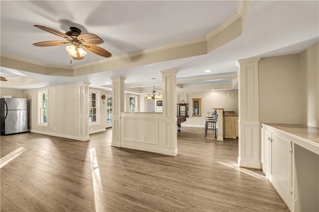 3855 Greenside Ct, Dacula, GA 30019 - unfurnished living room featuring ceiling fan, decorative columns, ornamental molding, and wood finished floors