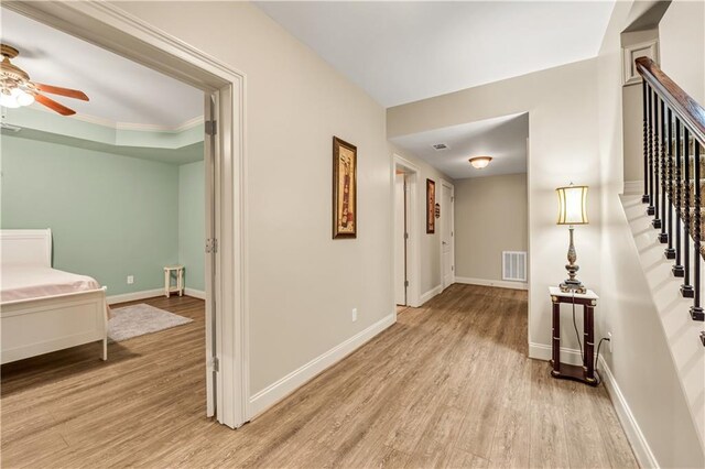 3855 Greenside Ct, Dacula, GA 30019 - corridor with visible vents, baseboards, stairway, and light wood-type flooring