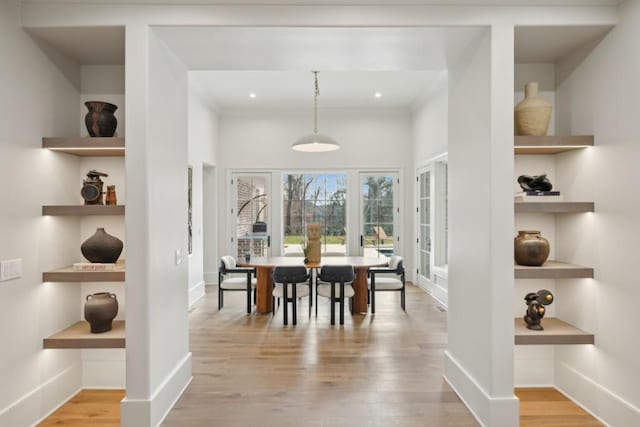 dining area featuring built in features and light hardwood / wood-style flooring