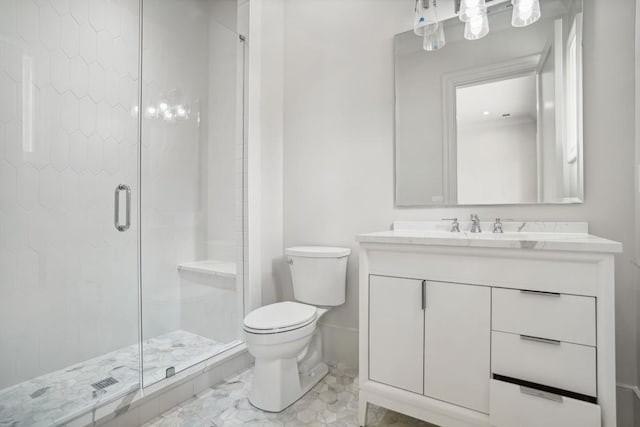 bathroom with a shower with door, vanity, and toilet