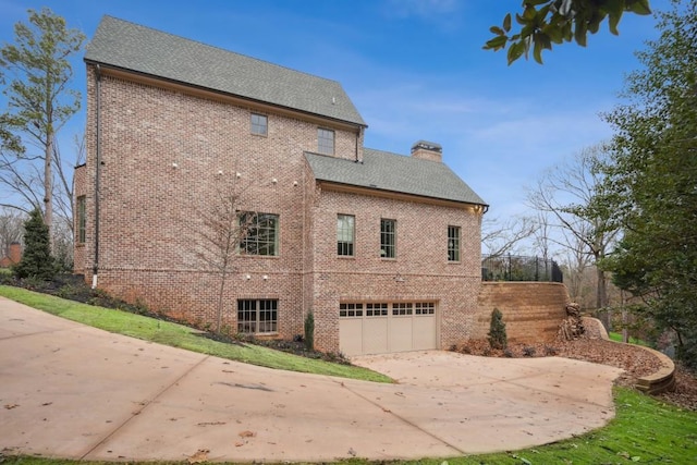 view of side of property with a garage