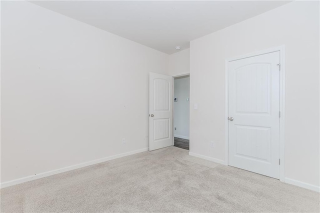 6706 Moondancer Ct, Flowery Branch, GA 30542 - unfurnished bedroom featuring light colored carpet and baseboards