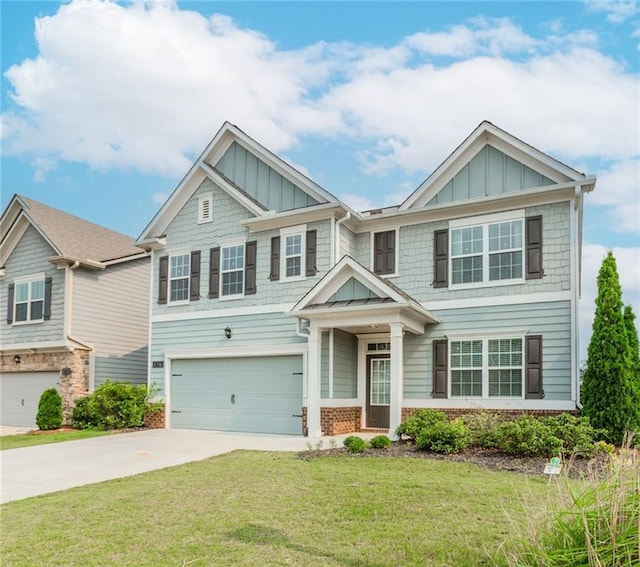 6706 Moondancer Ct, Flowery Branch, GA 30542 - craftsman house with an attached garage, driveway, board and batten siding, a front lawn, and brick siding
