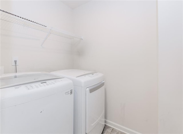 6706 Moondancer Ct, Flowery Branch, GA 30542 - laundry room featuring separate washer and dryer and baseboards