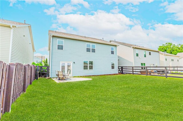 6706 Moondancer Ct, Flowery Branch, GA 30542 - back of property featuring a fenced backyard and a patio area