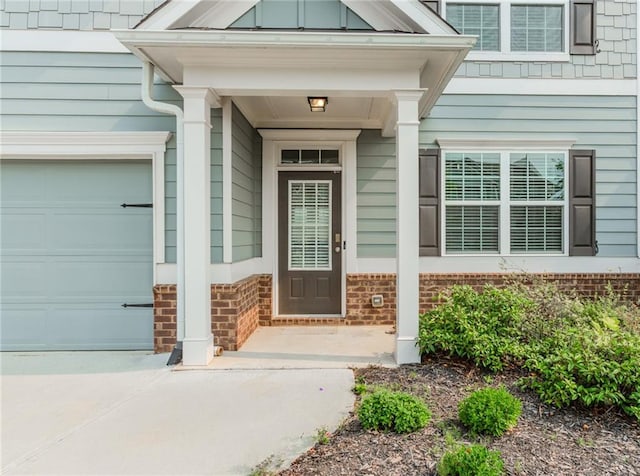 6706 Moondancer Ct, Flowery Branch, GA 30542 - property entrance with an attached garage and brick siding