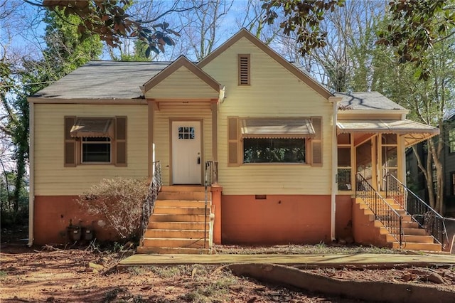 bungalow featuring crawl space and a shingled roof