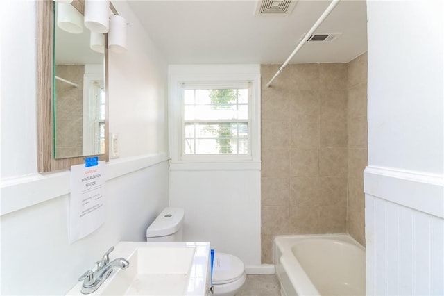 full bath featuring bathtub / shower combination, toilet, and visible vents