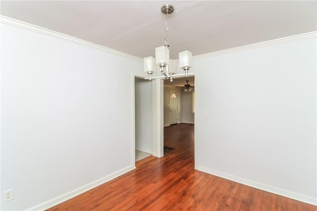 unfurnished room with ceiling fan with notable chandelier, crown molding, baseboards, and wood finished floors