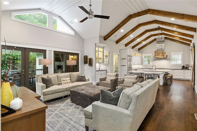 living area with a ceiling fan, high vaulted ceiling, dark wood-type flooring, and recessed lighting