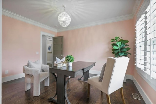 dining room featuring dark wood-style floors, ornamental molding, and a wealth of natural light