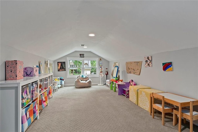 recreation room featuring vaulted ceiling, carpet floors, and baseboards