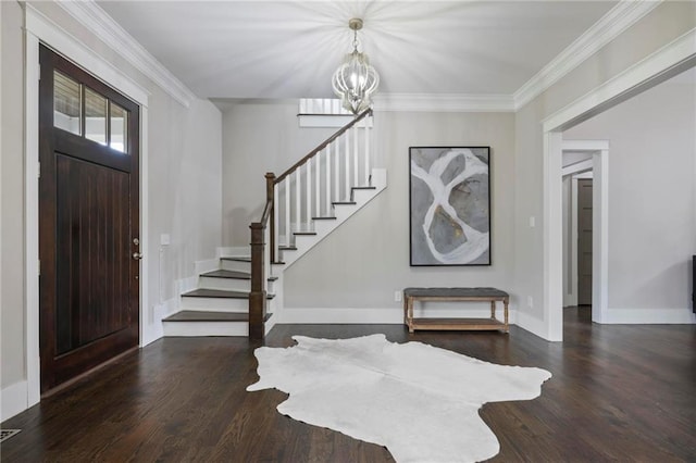 foyer featuring stairway, baseboards, ornamental molding, and wood finished floors