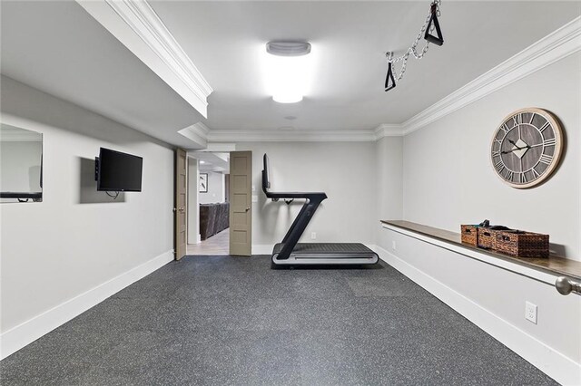 exercise area with crown molding and baseboards