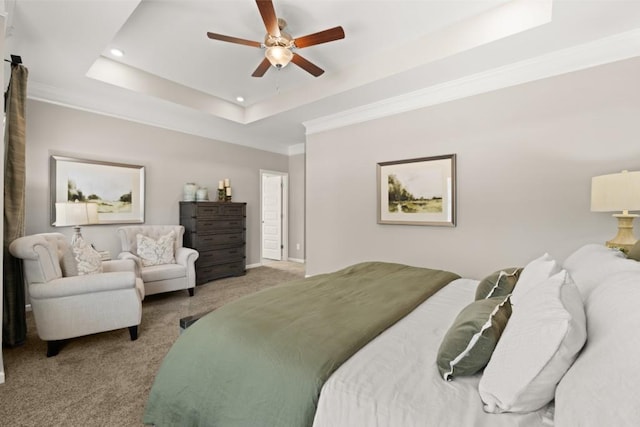 bedroom with ornamental molding, recessed lighting, a raised ceiling, and light colored carpet