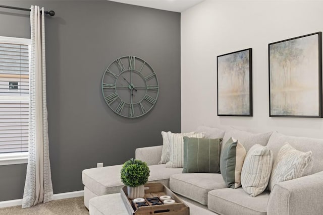 living area with carpet and baseboards