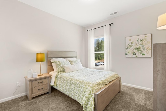 bedroom with carpet flooring, visible vents, and baseboards