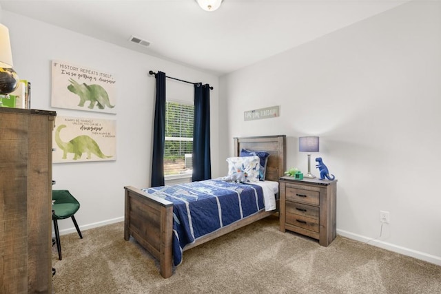 bedroom with carpet, visible vents, and baseboards