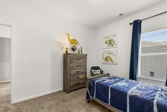 bedroom with light carpet, visible vents, and baseboards