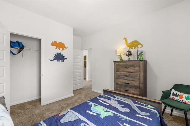 bedroom featuring carpet, baseboards, and a closet