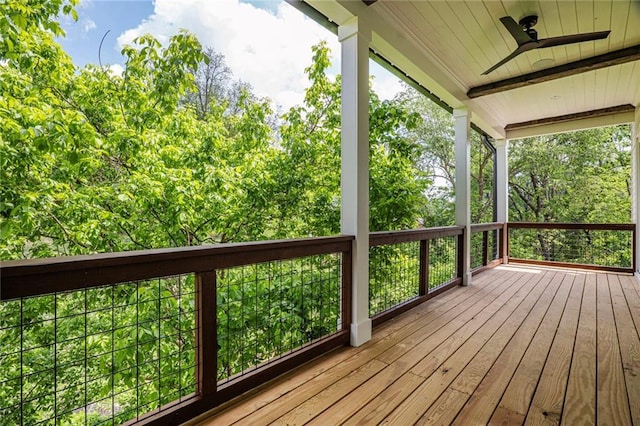 wooden terrace with a ceiling fan