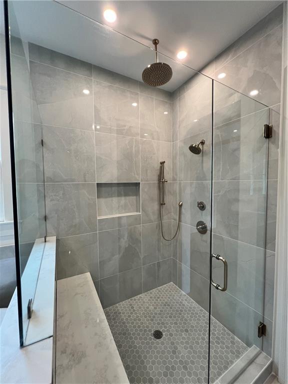 full bath featuring a shower stall and recessed lighting