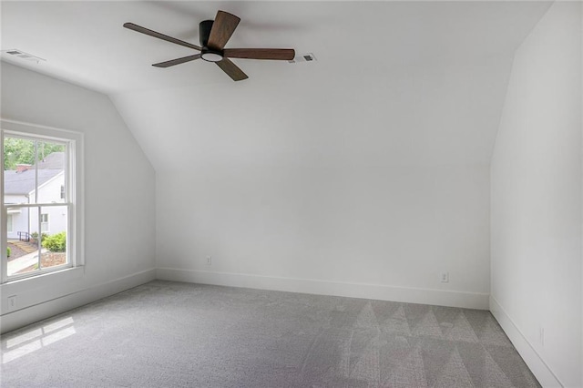 bonus room with carpet, vaulted ceiling, ceiling fan, and baseboards