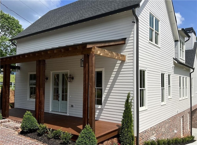 view of property exterior featuring covered porch