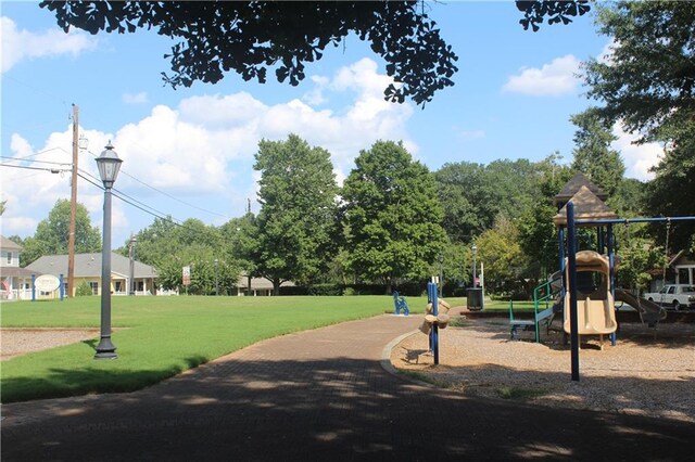 view of home's community with a lawn