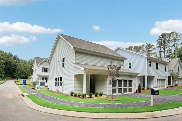 view of front of home with driveway and an attached garage