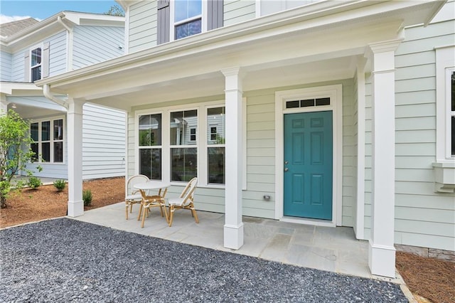 entrance to property featuring a porch