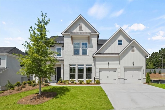 view of front of property with a garage and a front lawn