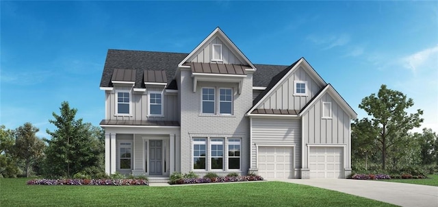 view of front of property with a garage and a front lawn