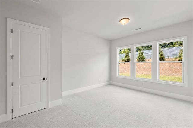 empty room with light colored carpet